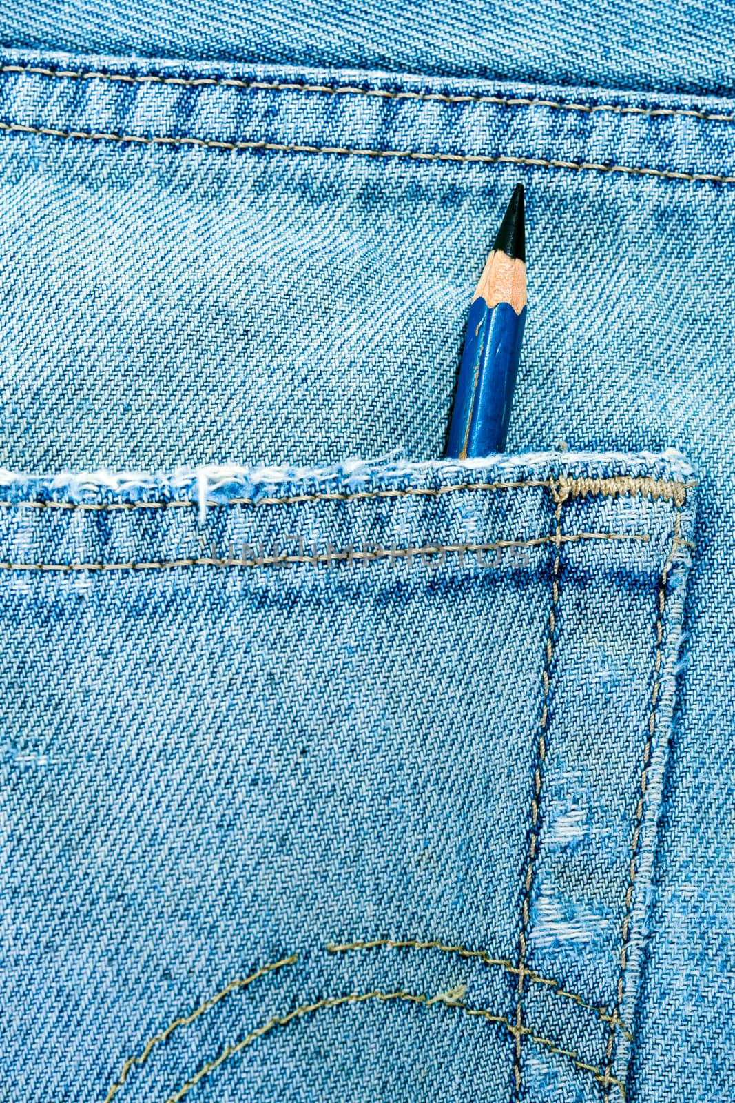 EE type Pencil in the pocket of denim blue jean