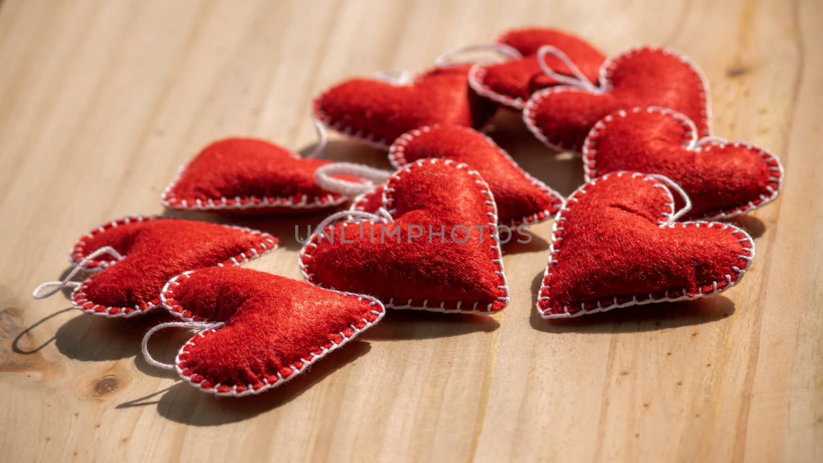 Set of Red hearts on a wooden table, romantic handcrafts for Valentine's day.