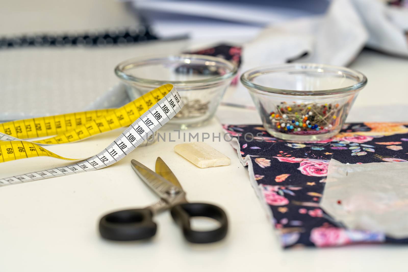 tailor's tape measure on a sewing table in a tailor shop