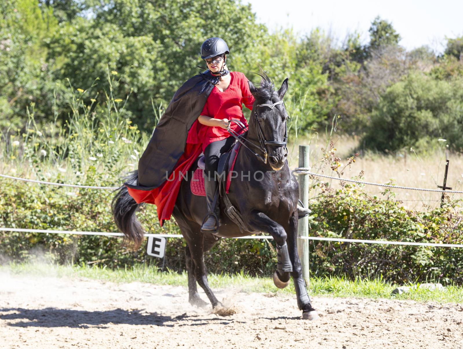  riding girl are training her black horse