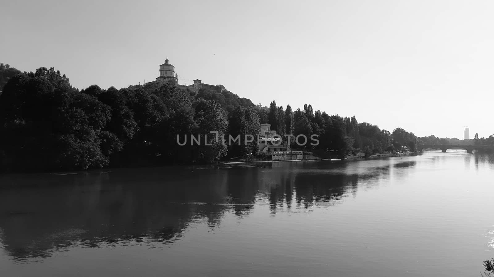 Liguria, Italy - 08/15/2020:  Reflection of sunrise for blur background in summer days over the water. Clear blue sky hot climate in summer days.