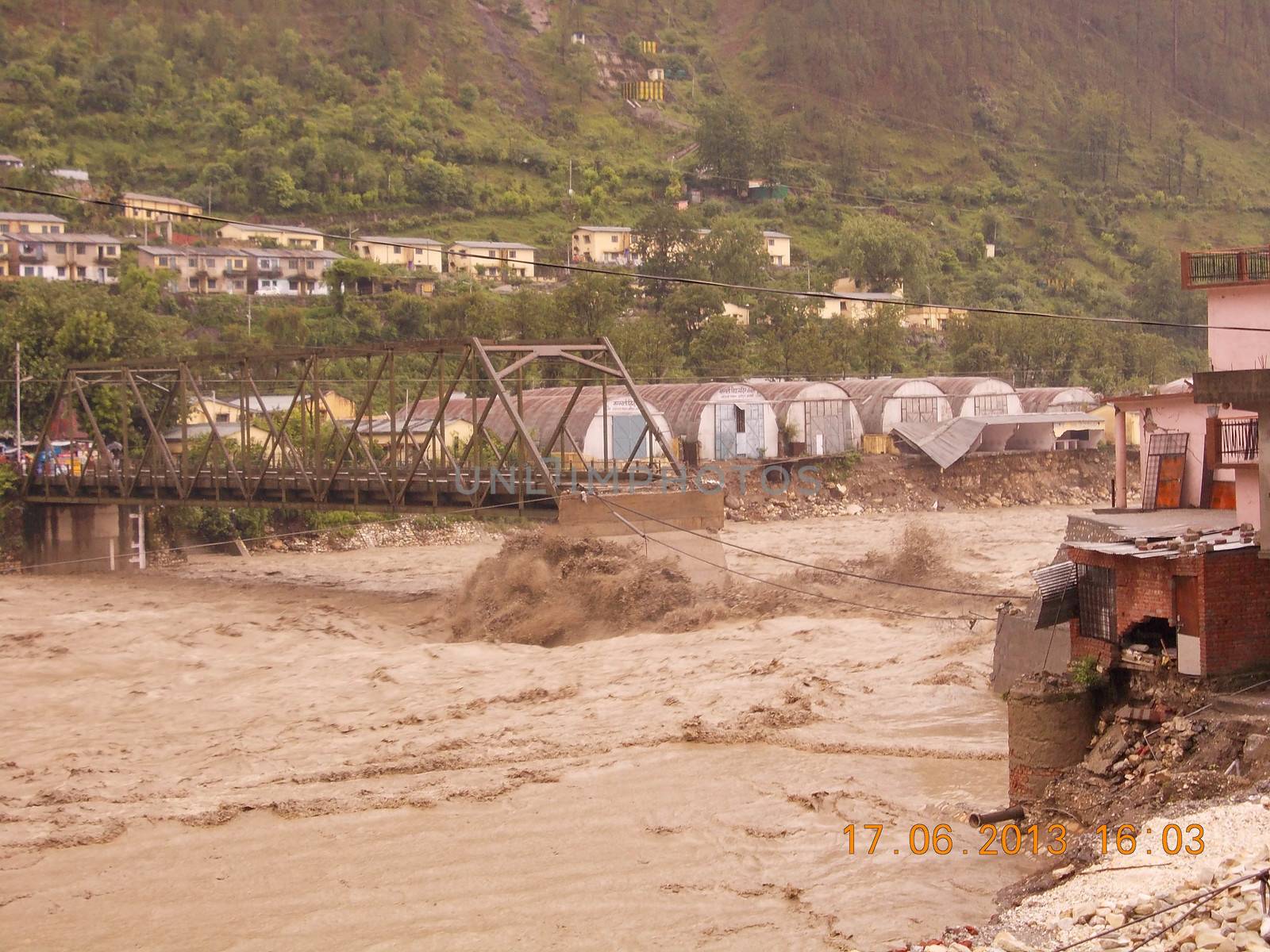 Himalayan tsunami or flood in Ganges India. The Ganges River has been heavily flooded in 2012 and 2013, causing widespread Destruction. High quality photo