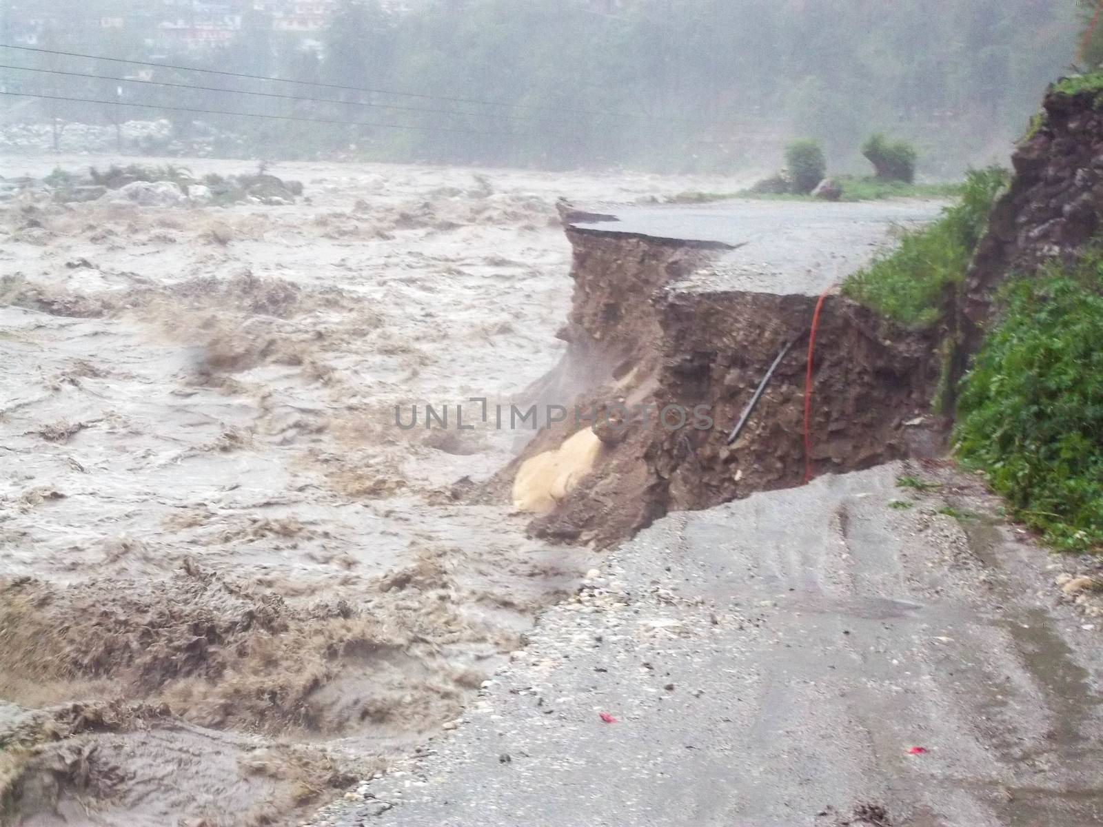 Himalayan tsunami or flood in Ganges India. The Ganges River has been heavily flooded in 2012 and 2013, causing widespread Destruction. High quality photo