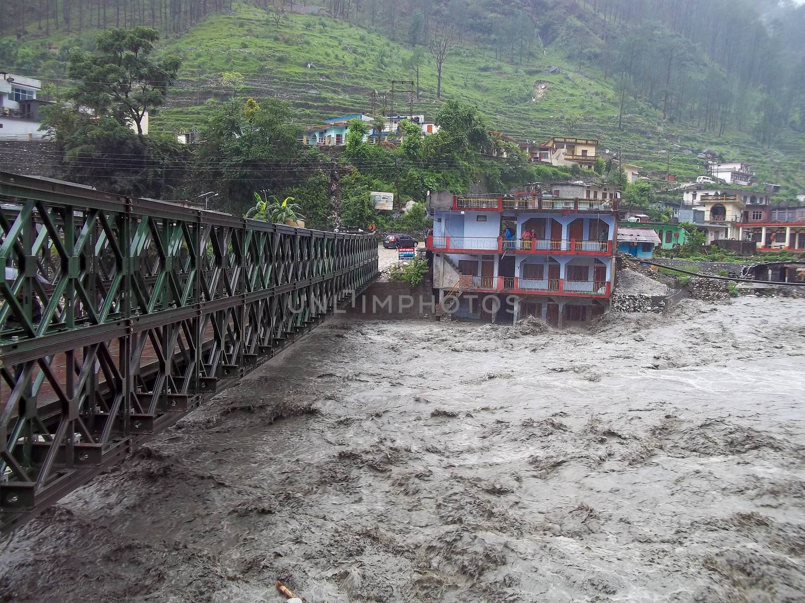 Himalayan tsunami or flood in Ganges India. The Ganges River has been heavily flooded in 2012 and 2013, causing widespread Destruction. High quality photo