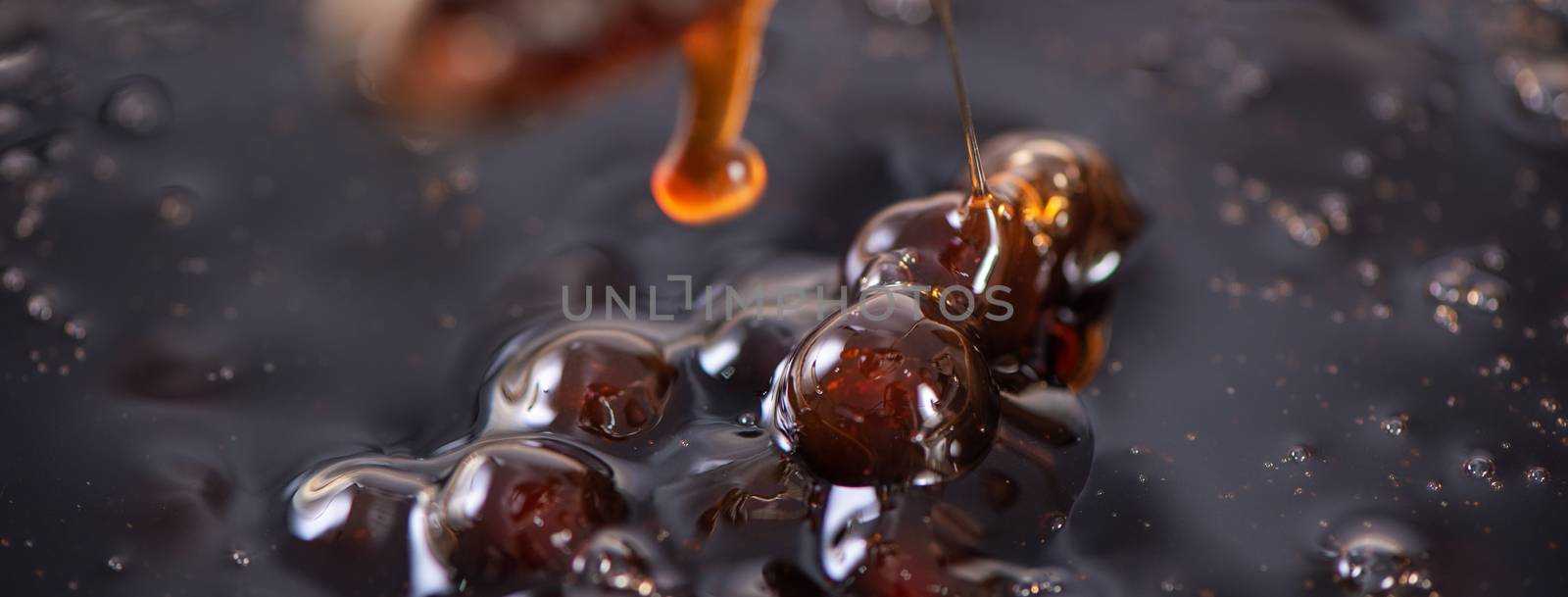 Cooking, boiling brown sugar flavored tapioca pearl balls, ingredient of bubble tea, preparing food and drink, close up, recipe cookbook steps design concept.