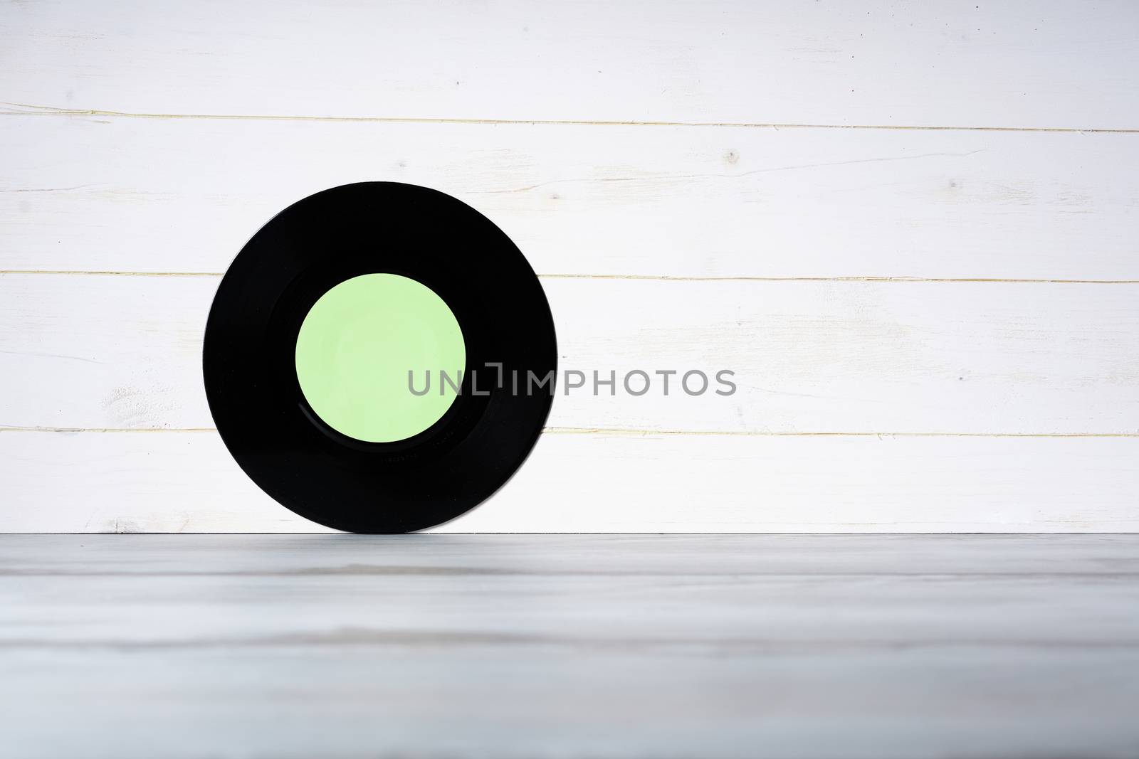 Vinyl record on white wooden background by Robertobinetti70