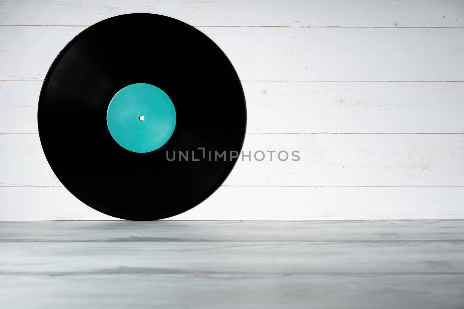 Vinyl record on white wooden background by Robertobinetti70