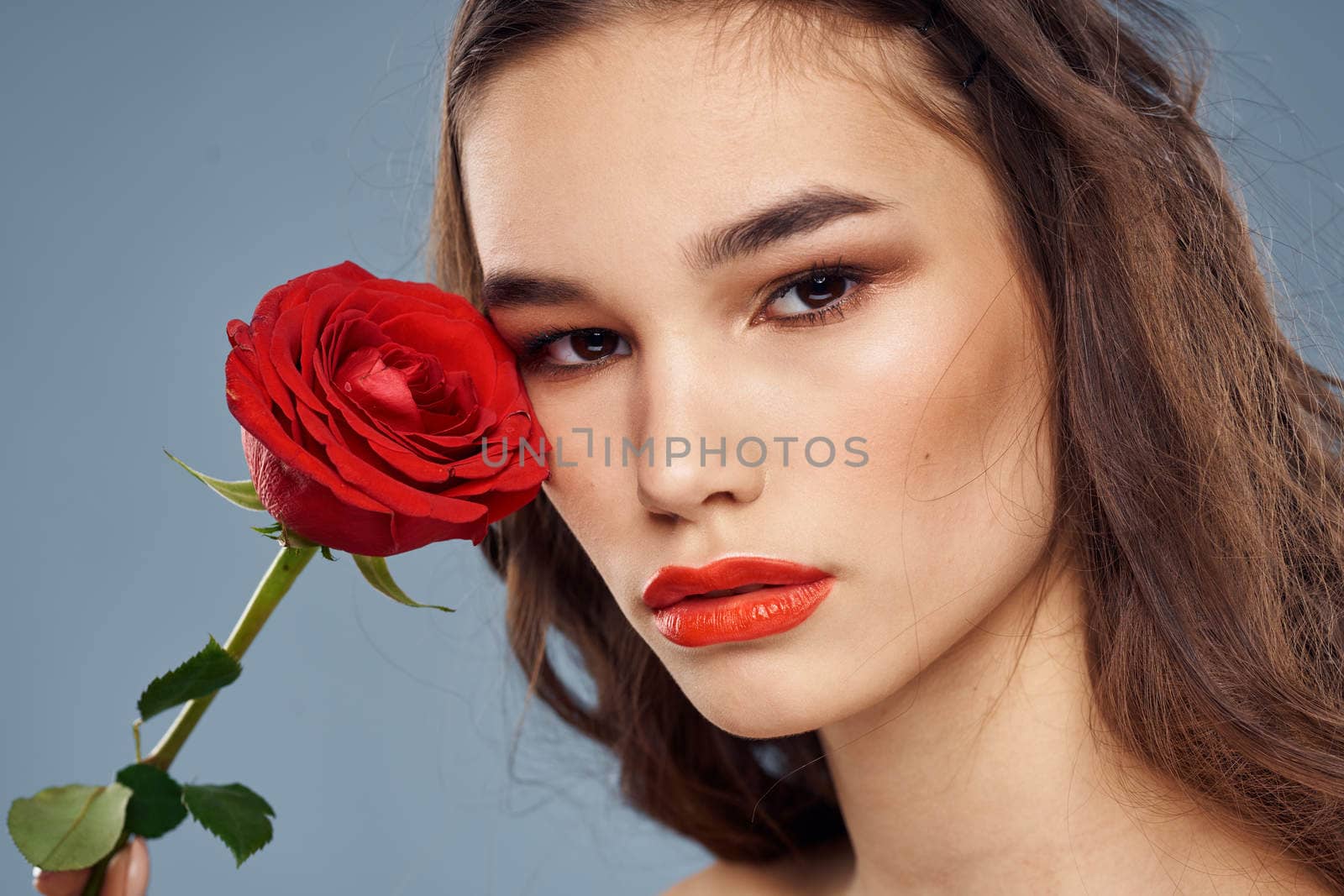 woman with a rose in her hands naked shoulders evening makeup red lips by SHOTPRIME