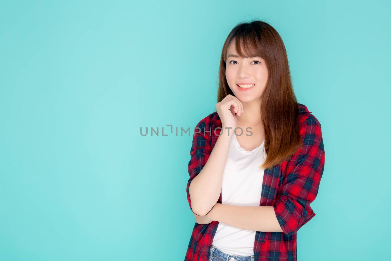 Beautiful portrait young asian woman wear clothes fashion travel smile expression confident enjoy summer holiday isolated blue background, model asia girl enjoy and cheerful, travel concept.