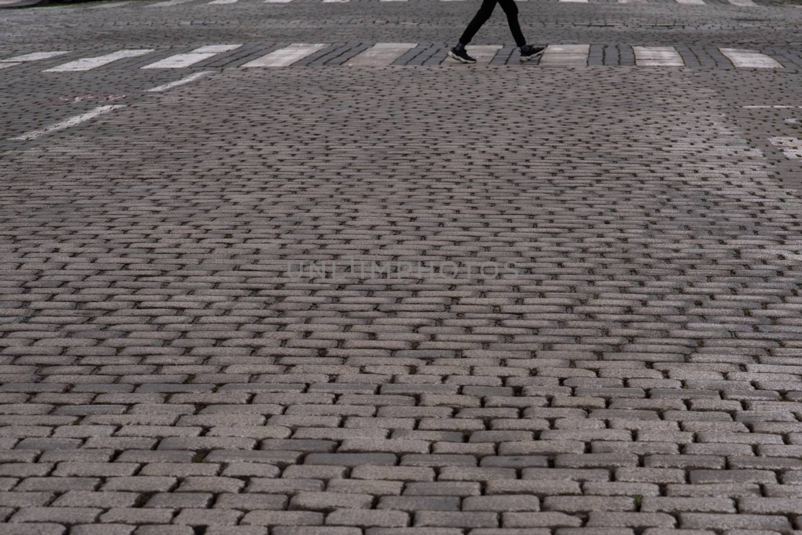 Empty street with a pedestrian walking