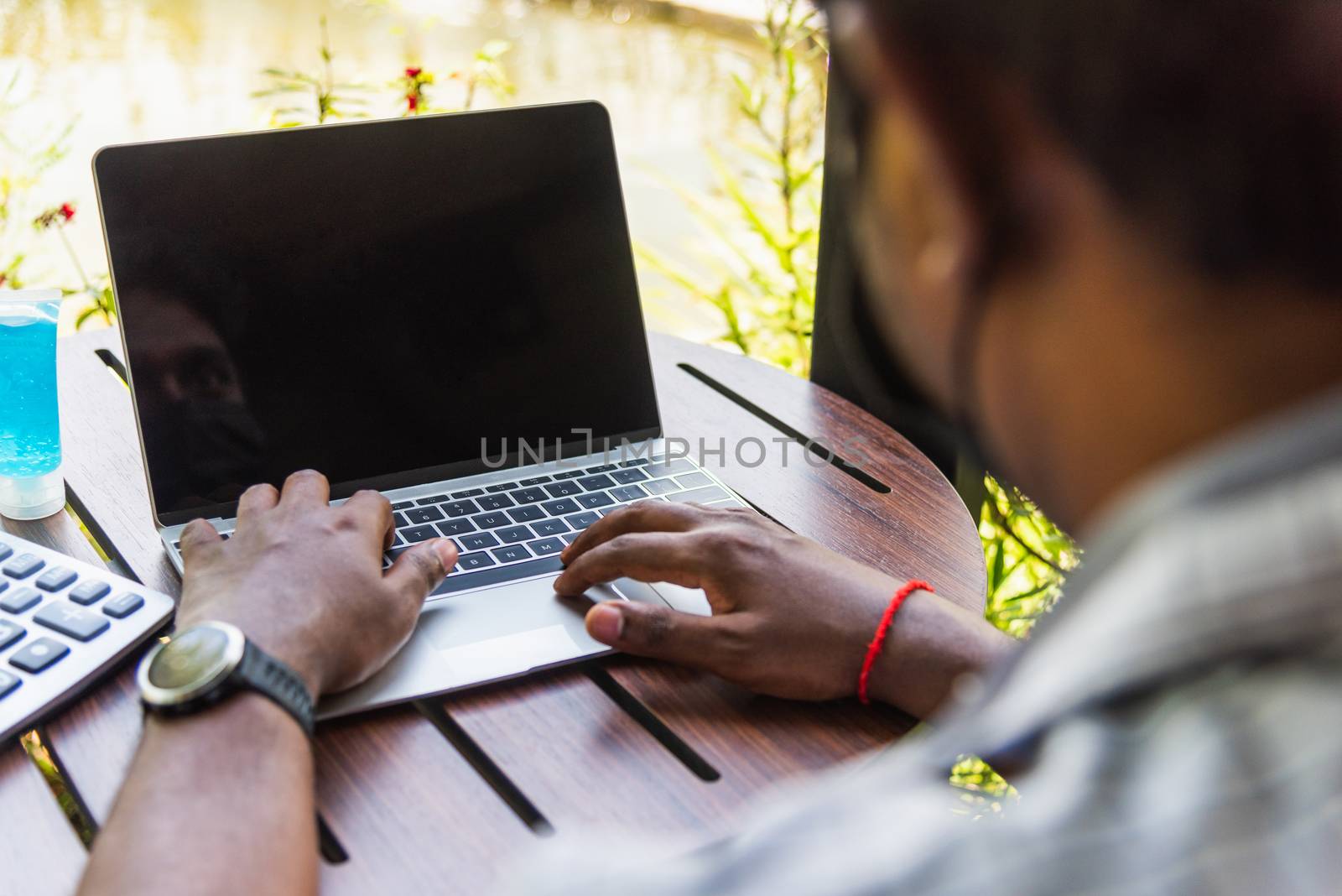 businessman sitting on desk work from home using laptop computer by Sorapop