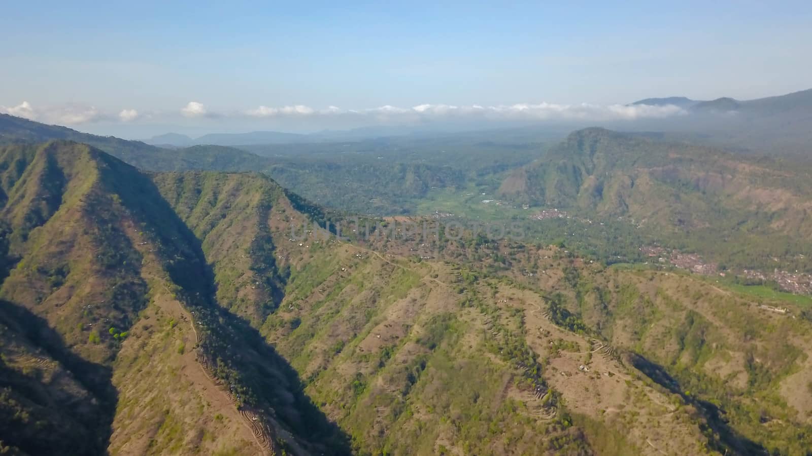 a drone aerial view of a countryside of bali. Aerial view of the mountains above the village of Amed, Indonesia.