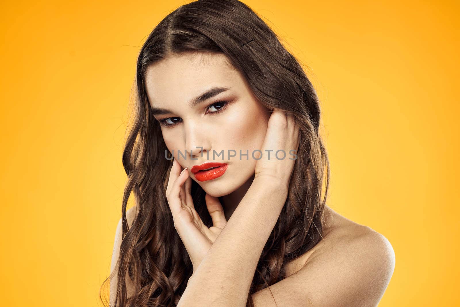 Woman with bare shoulders red cropped lips charm yellow background by SHOTPRIME