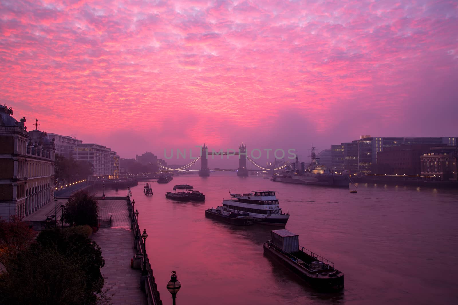 Vibrant altocumulus sunrise cloud above the River Thames in London, England by magicbones