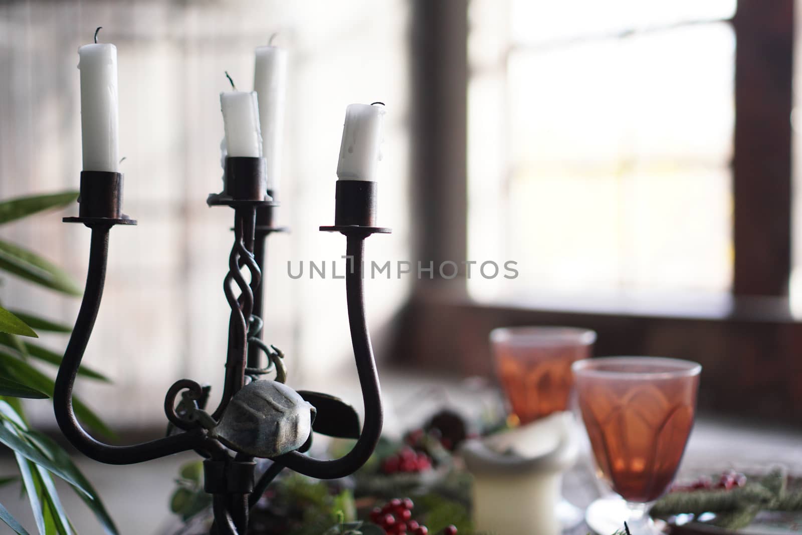 Forged metal candlestick with candles by natali_brill