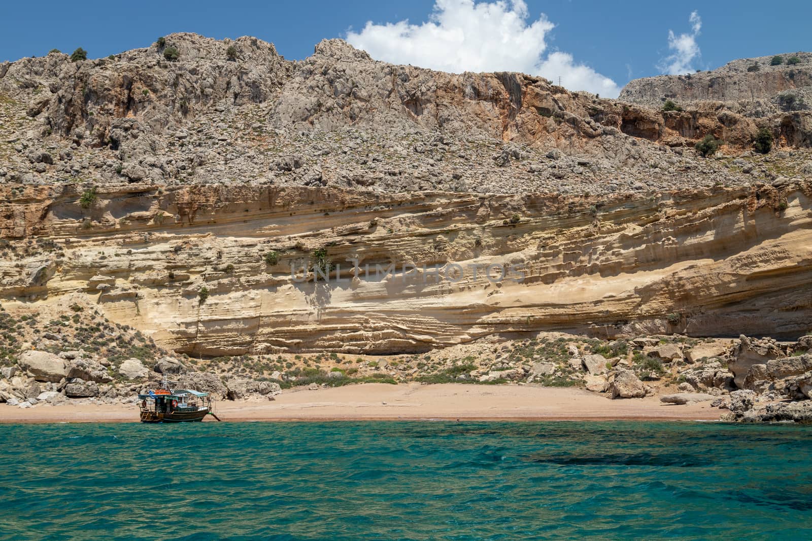 View from a motor boat on the mediterranean sea at the rocky coa by reinerc