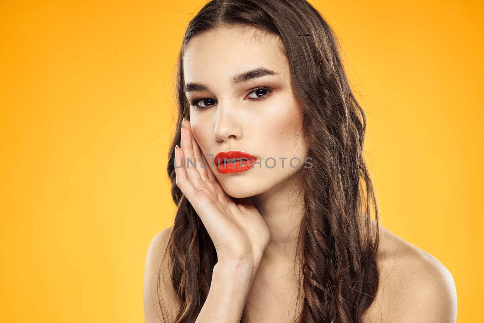Woman with bare shoulders red cropped lips charm yellow background by SHOTPRIME