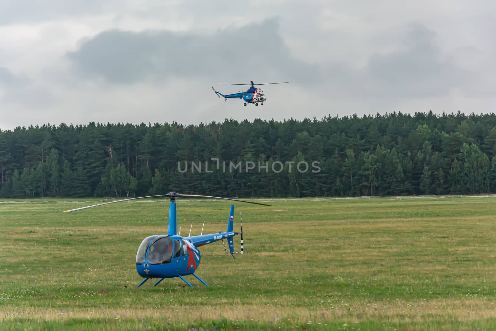 Belarus, Minsk - 07/25/2018: Helicopter on the airfield and the by Grommik
