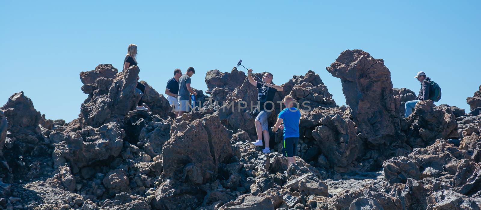 Spain, Tenerife - 09/15/2016: Tourists photo session on the volc by Grommik