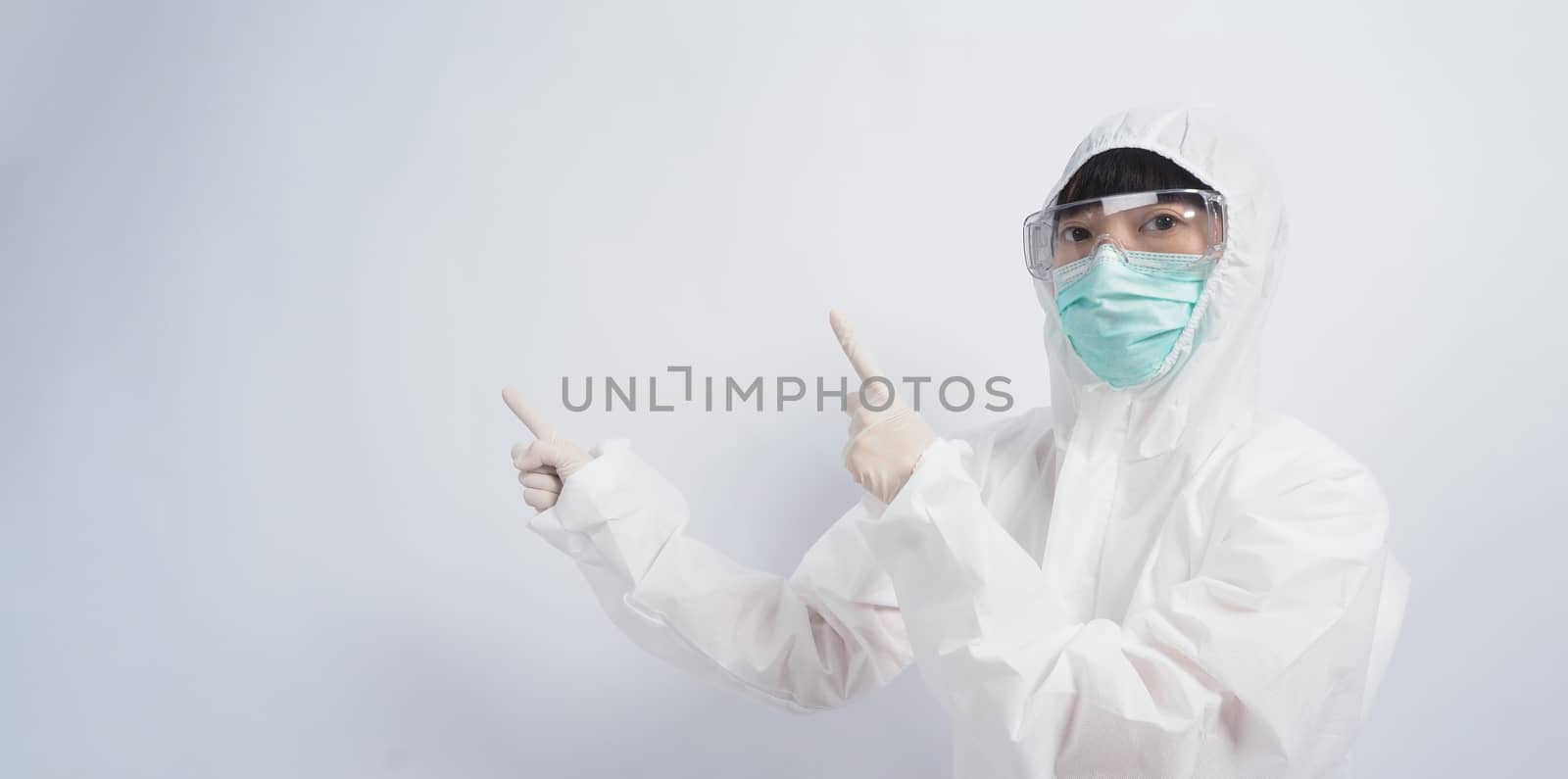 Asia woman doctor in PPE suit or Personal Protective Equipment  by gnepphoto