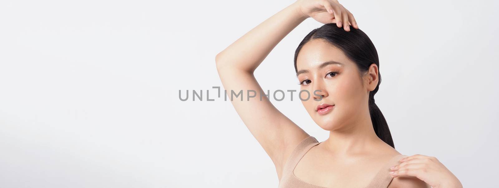 Young asian woman beauty face make up for skincare cosmetic and showing natural wellness soft and firm and ageless facial skin. she younger-looking or youthful. studio shot white background.