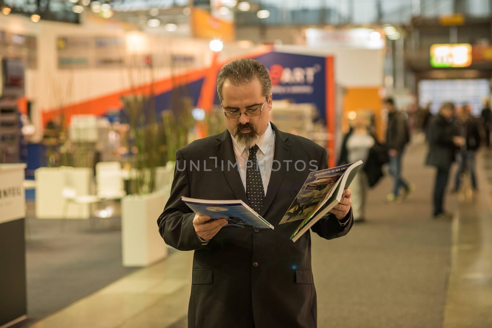 03/04/2018. Brno, Czech Republic. Man reading a report during a convention at the Brno Exhibition Center (BVV trade fairs brno) by gonzalobell