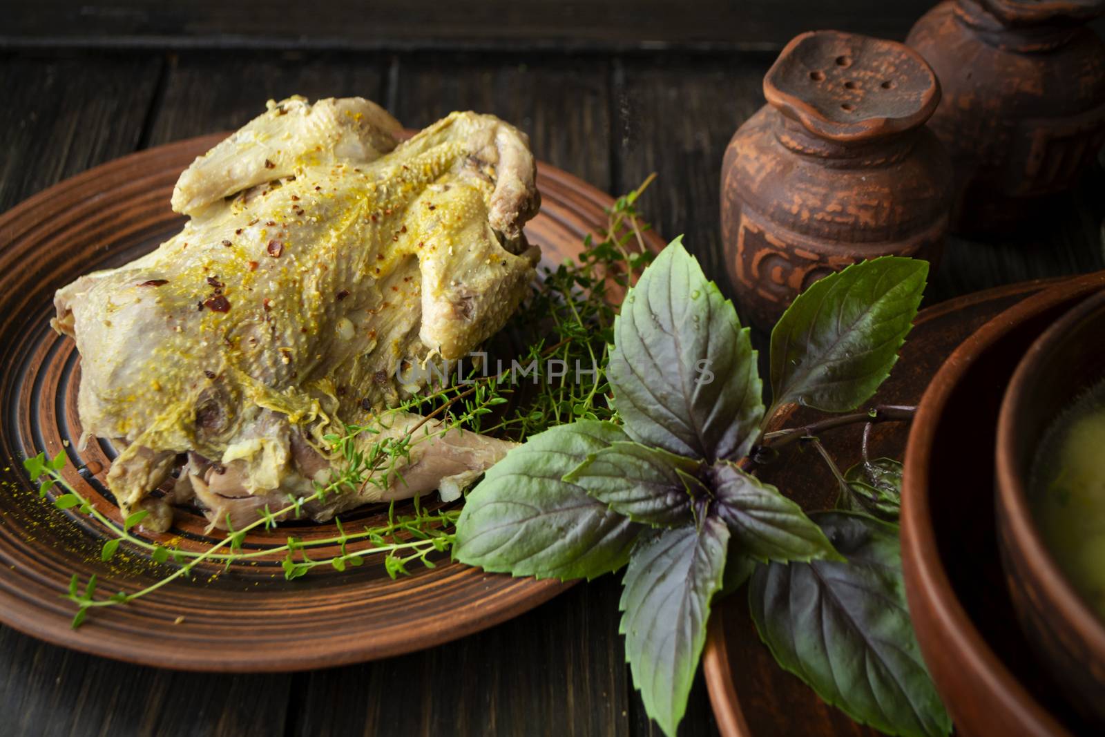 roast wild partridge plated meal on rustic table and brown plate