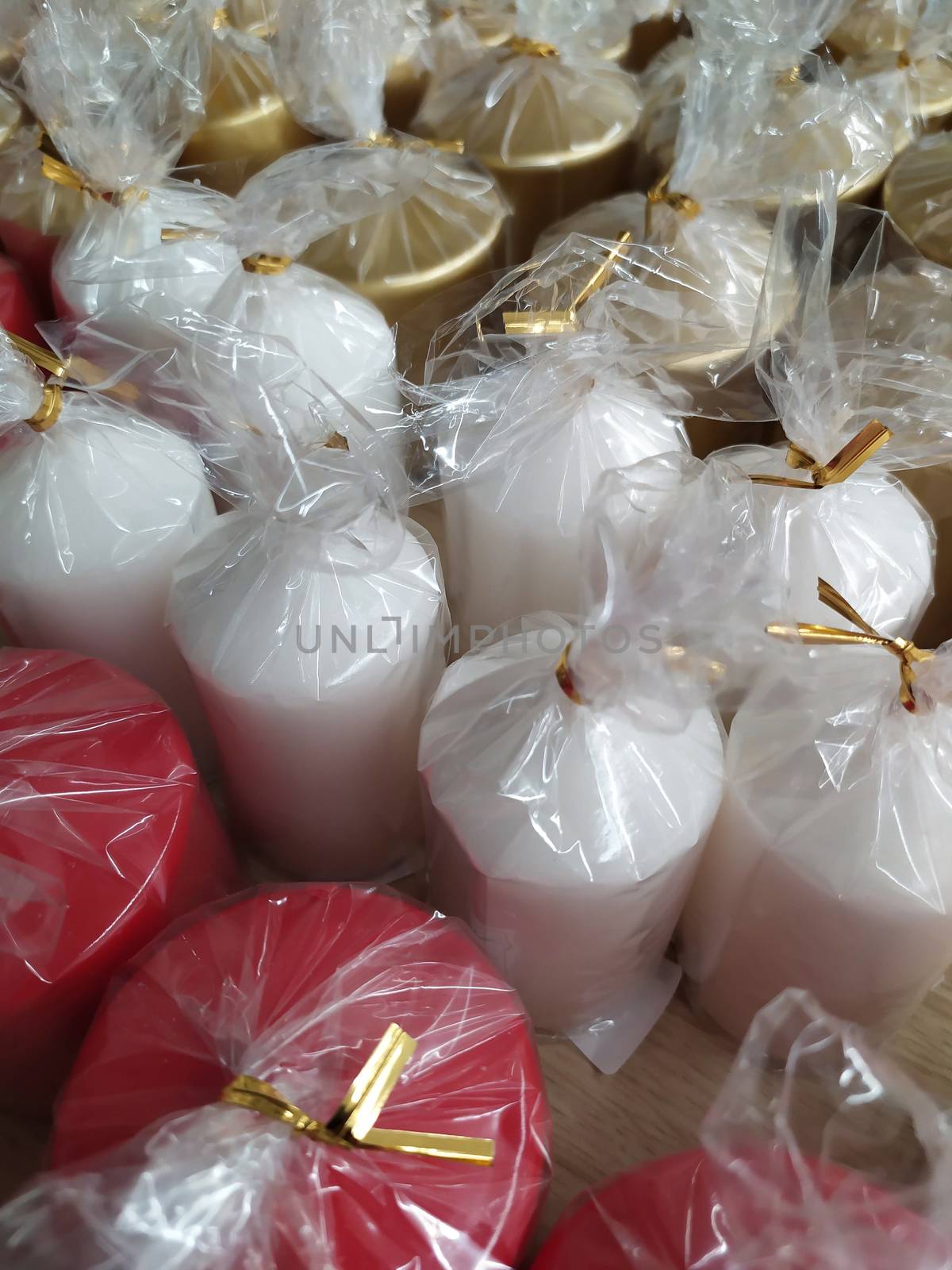 Festive decorations in the covid period of Christmas 2020, colored candles in transparent bags