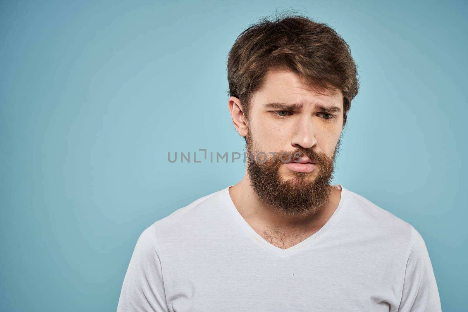 Bearded man emotions white t-shirt lifestyle gestures with hands blue backgrounds by SHOTPRIME