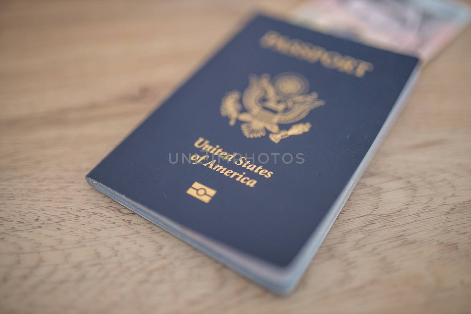 United States of America Passport with a blurry Five Honduran Lempiras Bill Partially Inside