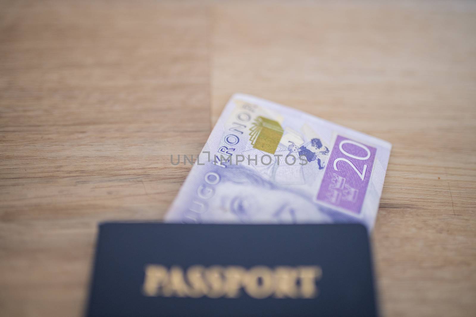 Picture of a Twenty Swedish Kronor Banknote Inside a blurry United States of America Passport