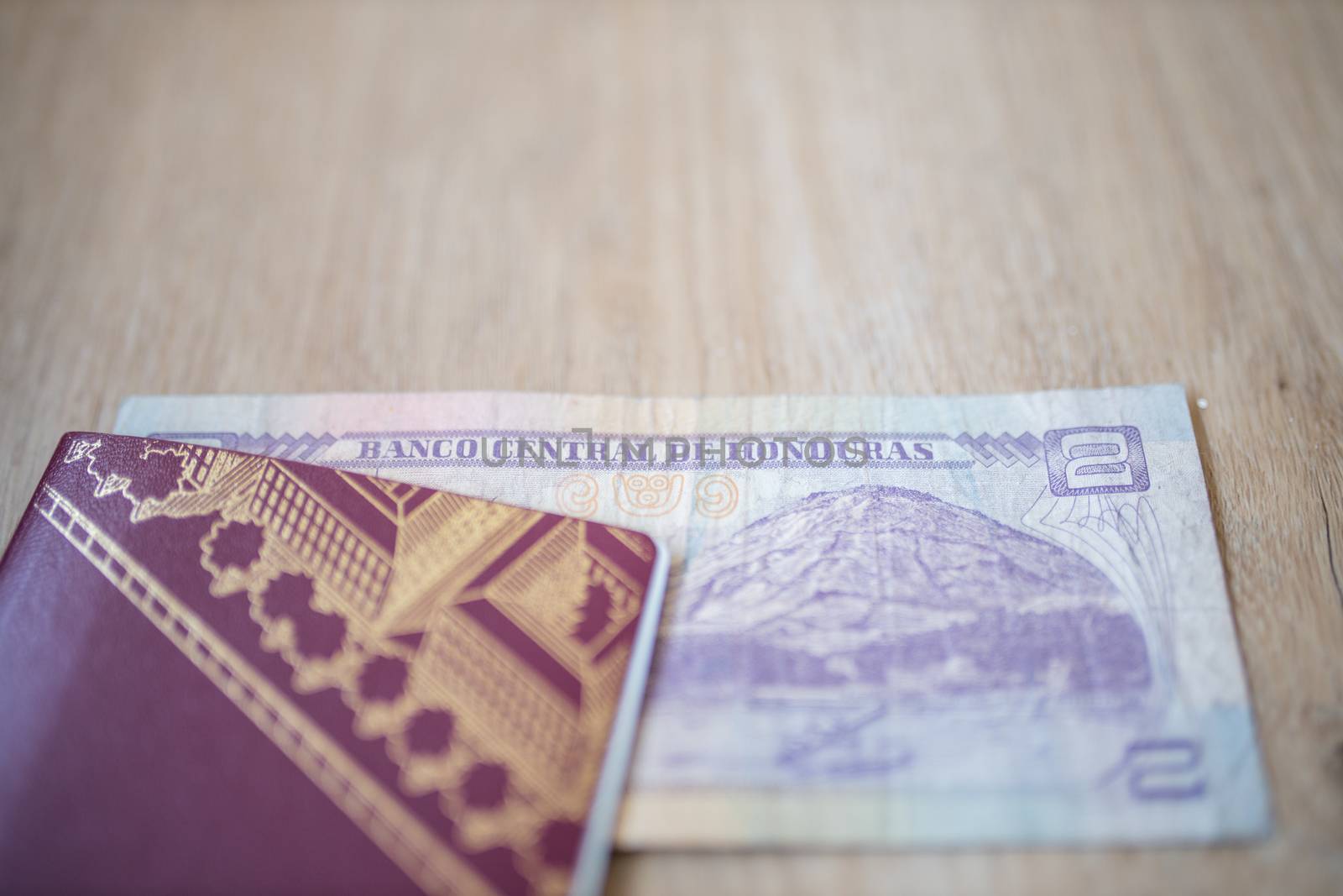 Picture of a Swedish Passport with a Two Honduran Lempiras Bill partially inside it