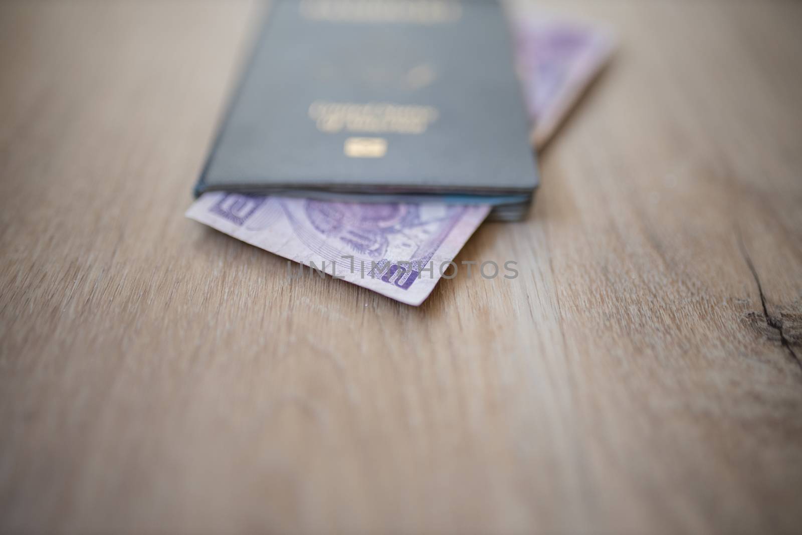 Picture of the corner of a Two Honduran Lempiras Bill shown from inside a United States of America Passport