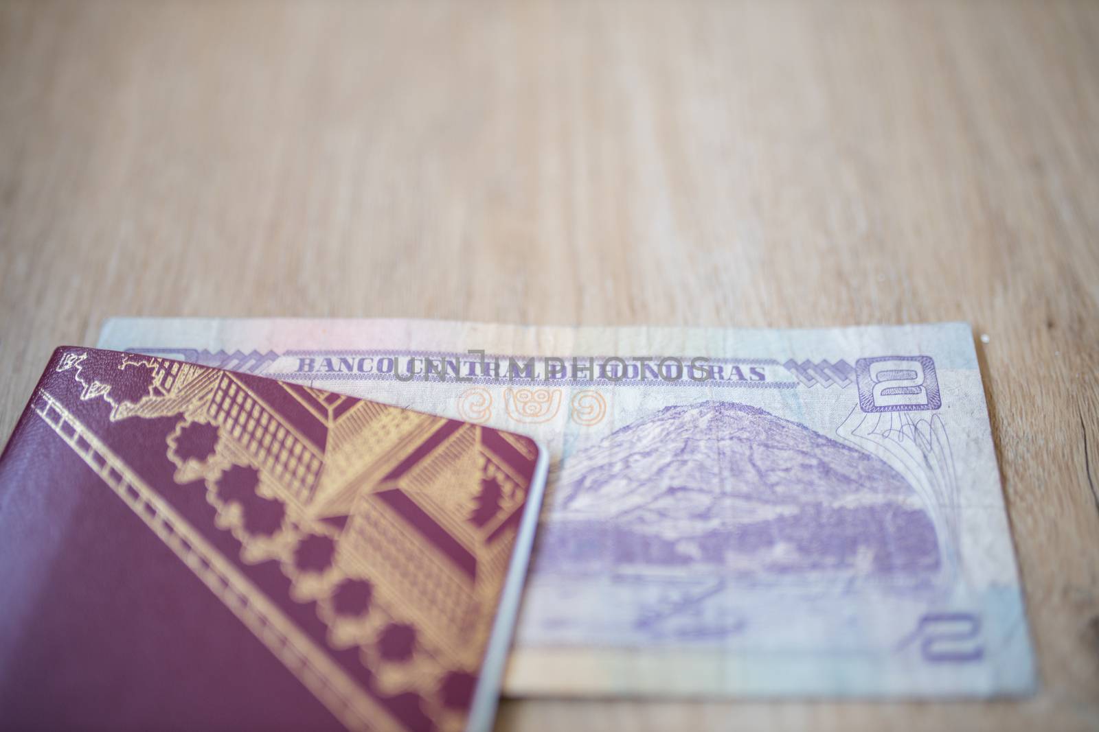 Picture of a Swedish Passport with a Two Honduran Lempiras Bill partially inside it