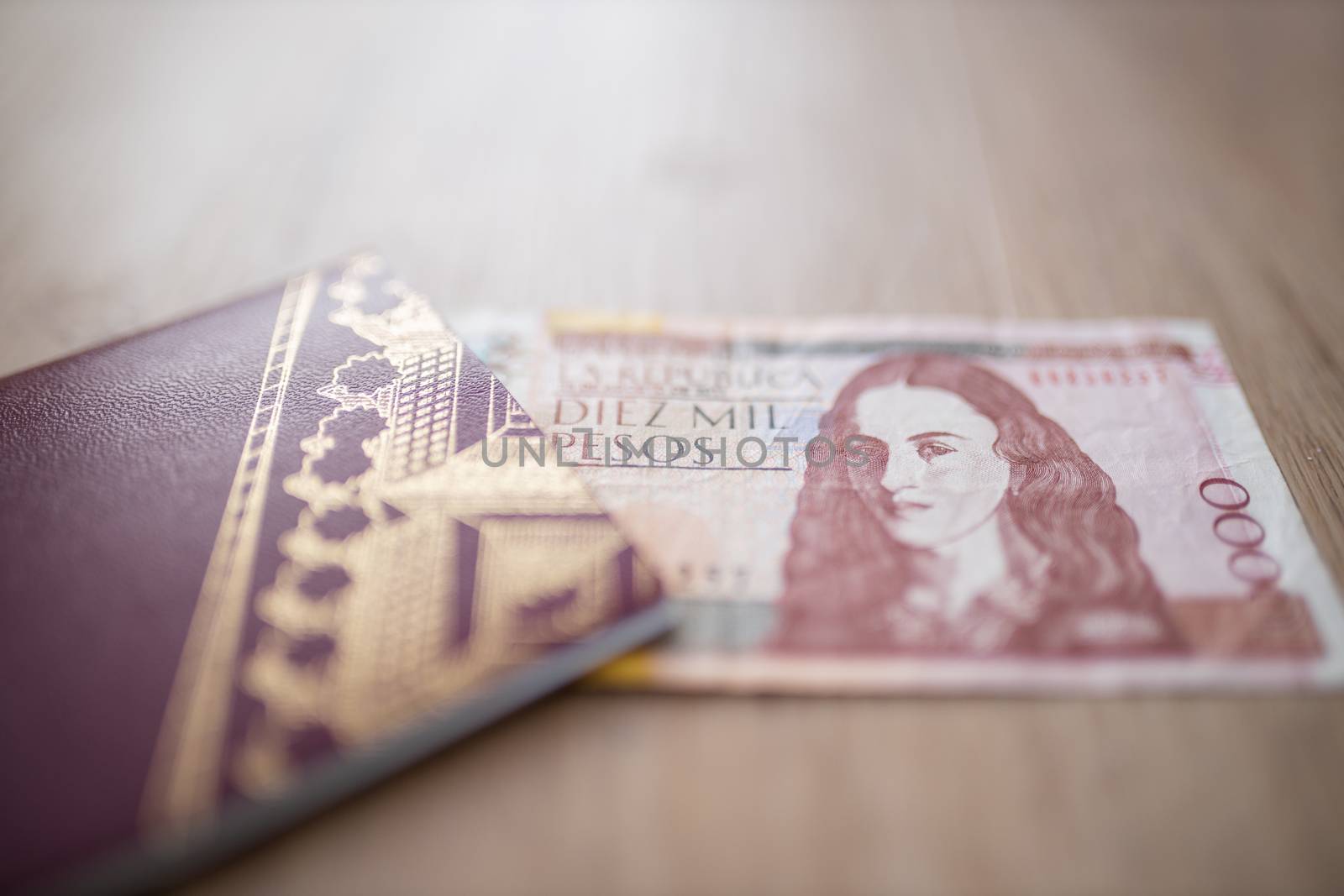 Swedish Passport with half a 10.000 Colombian Pesos Bill Inside