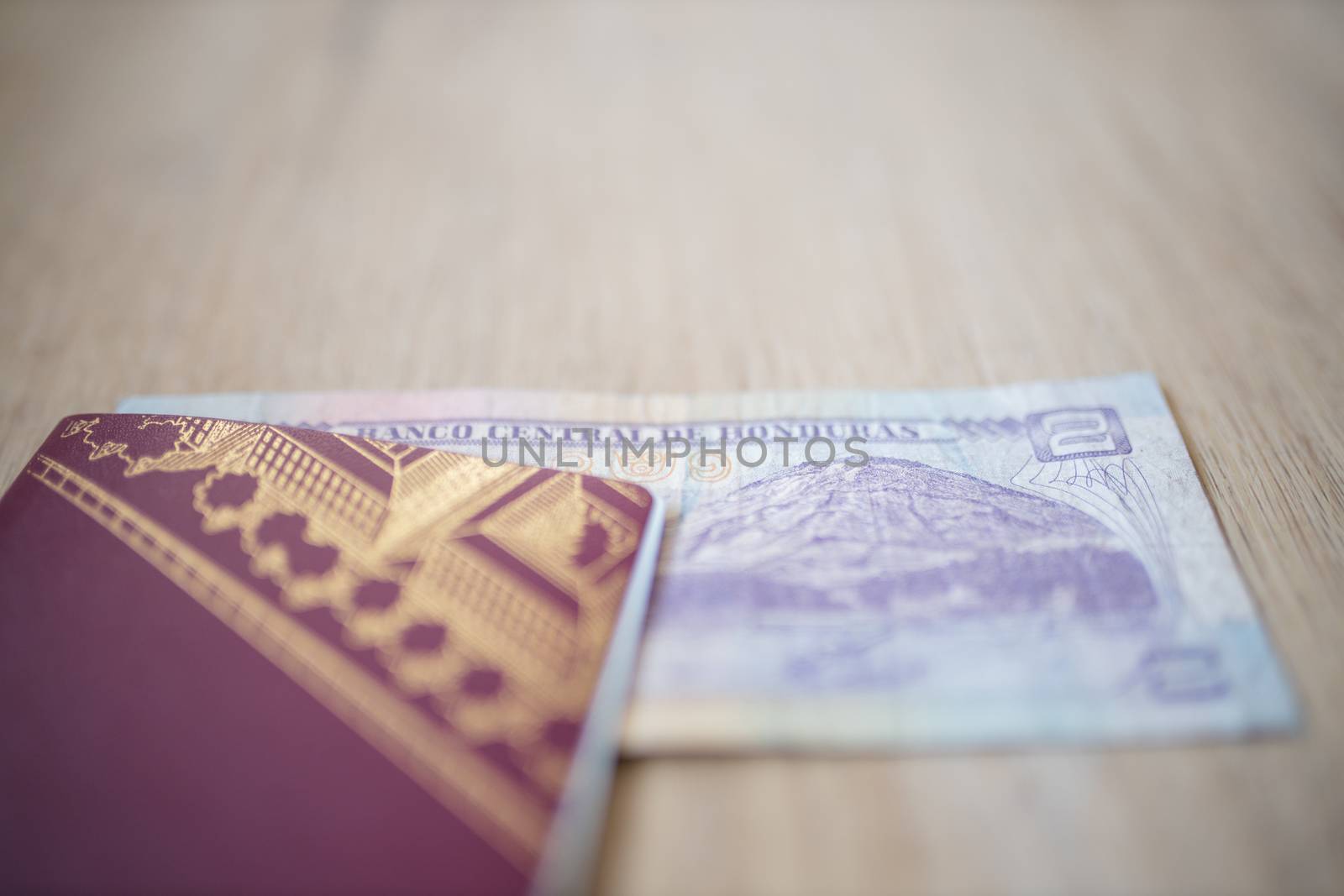 Picture of a Swedish Passport with a Two Honduran Lempiras Bill partially inside it