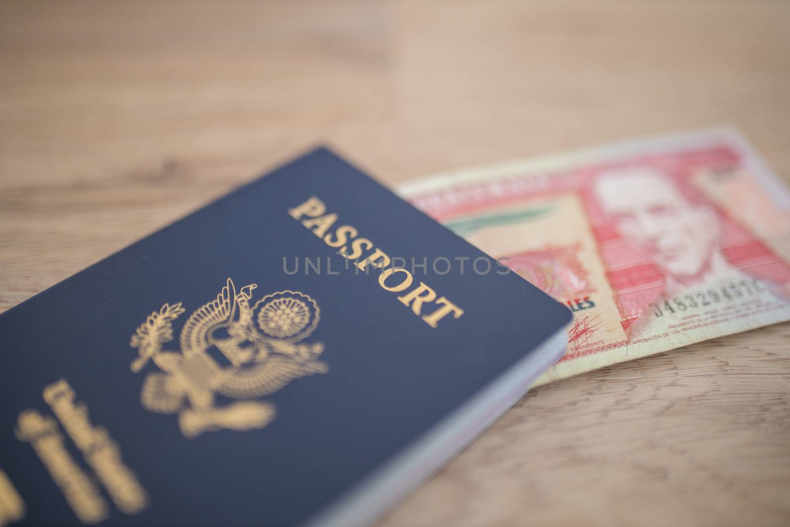 Picture of a United States of America Passport with a Blurry Ten Guatemalan Quetzales Bill Inside