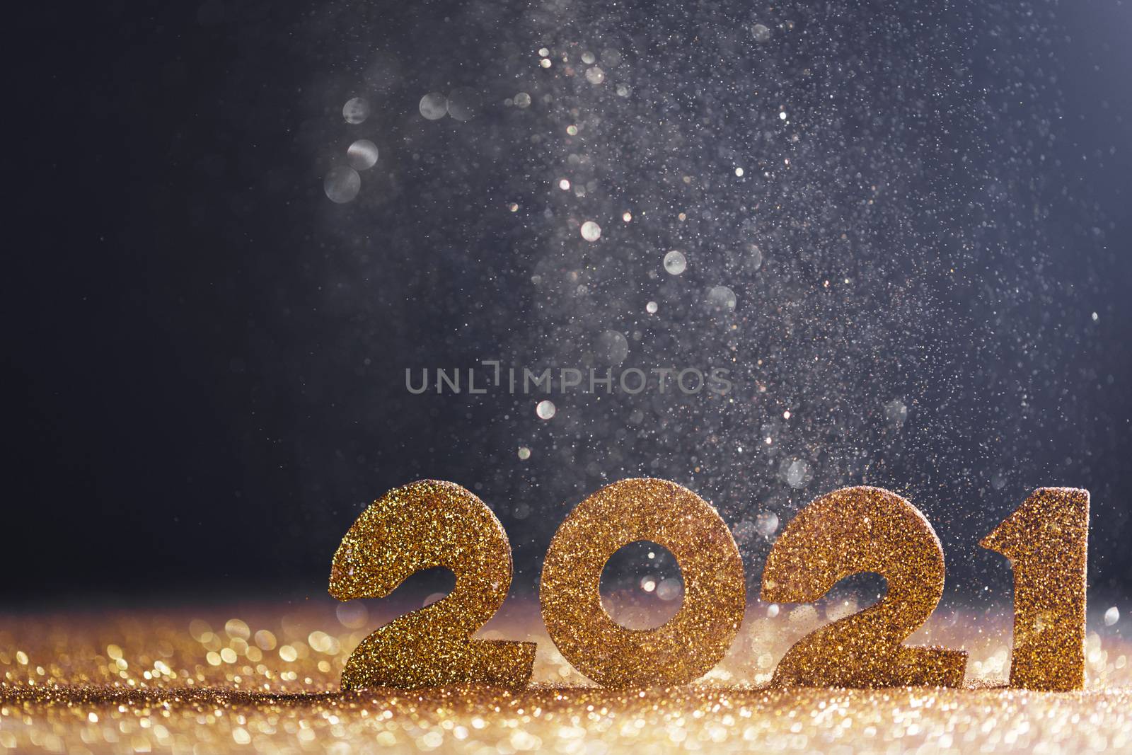 Happy new year 2021 celebration, glitter numbers on blue background