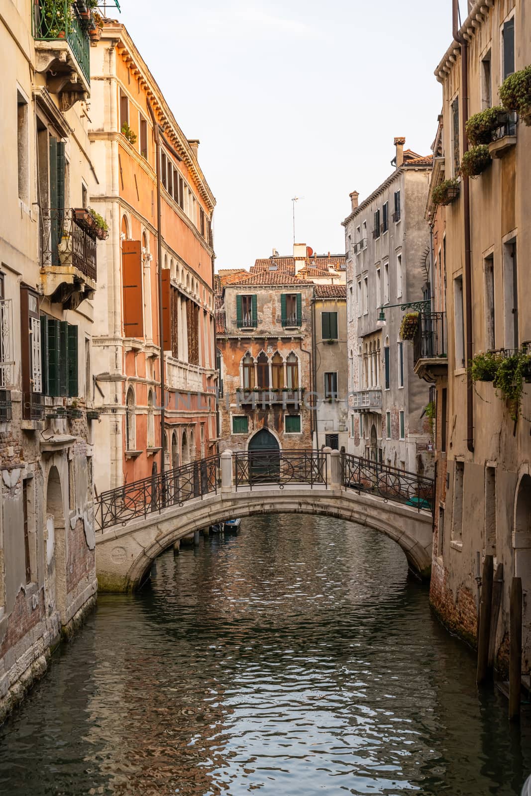 One of the countless beautiful small canals in the old town of Venice, Italy