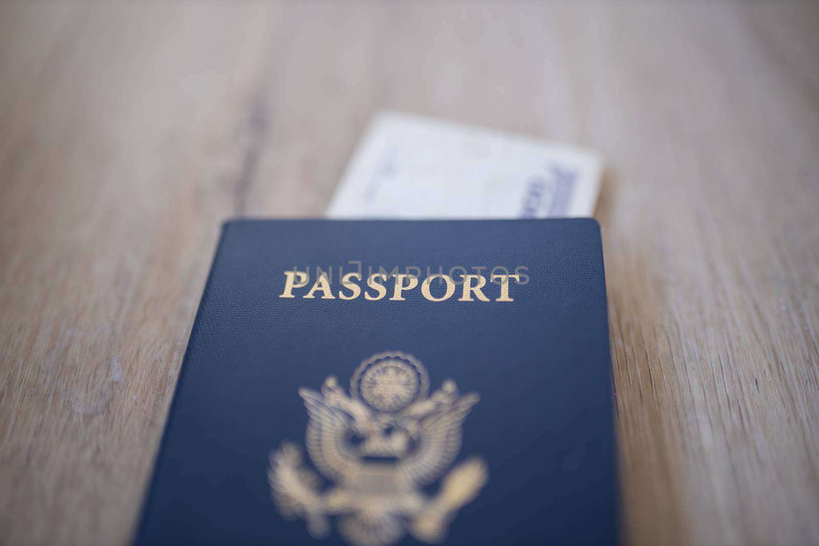 Picture of a United States of America Passport with a Blurry Two Honduran Lempiras Bill under it