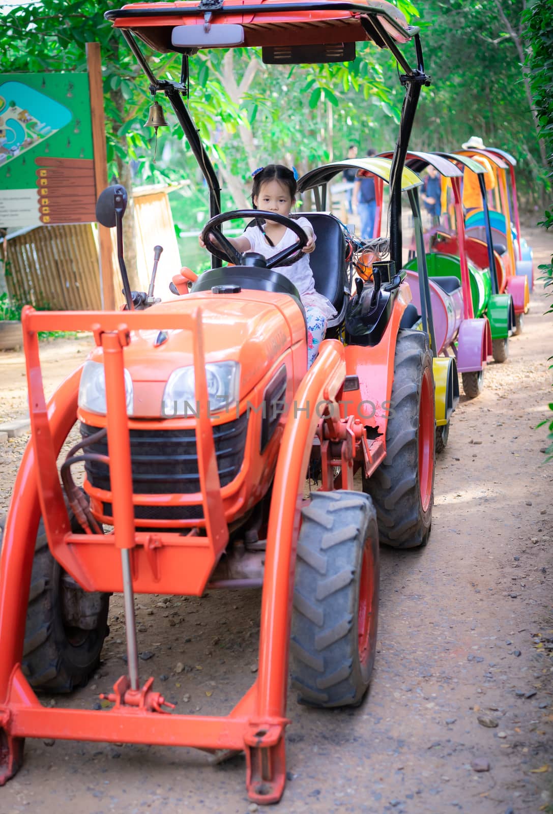 little girl playing to drive a train by domonite