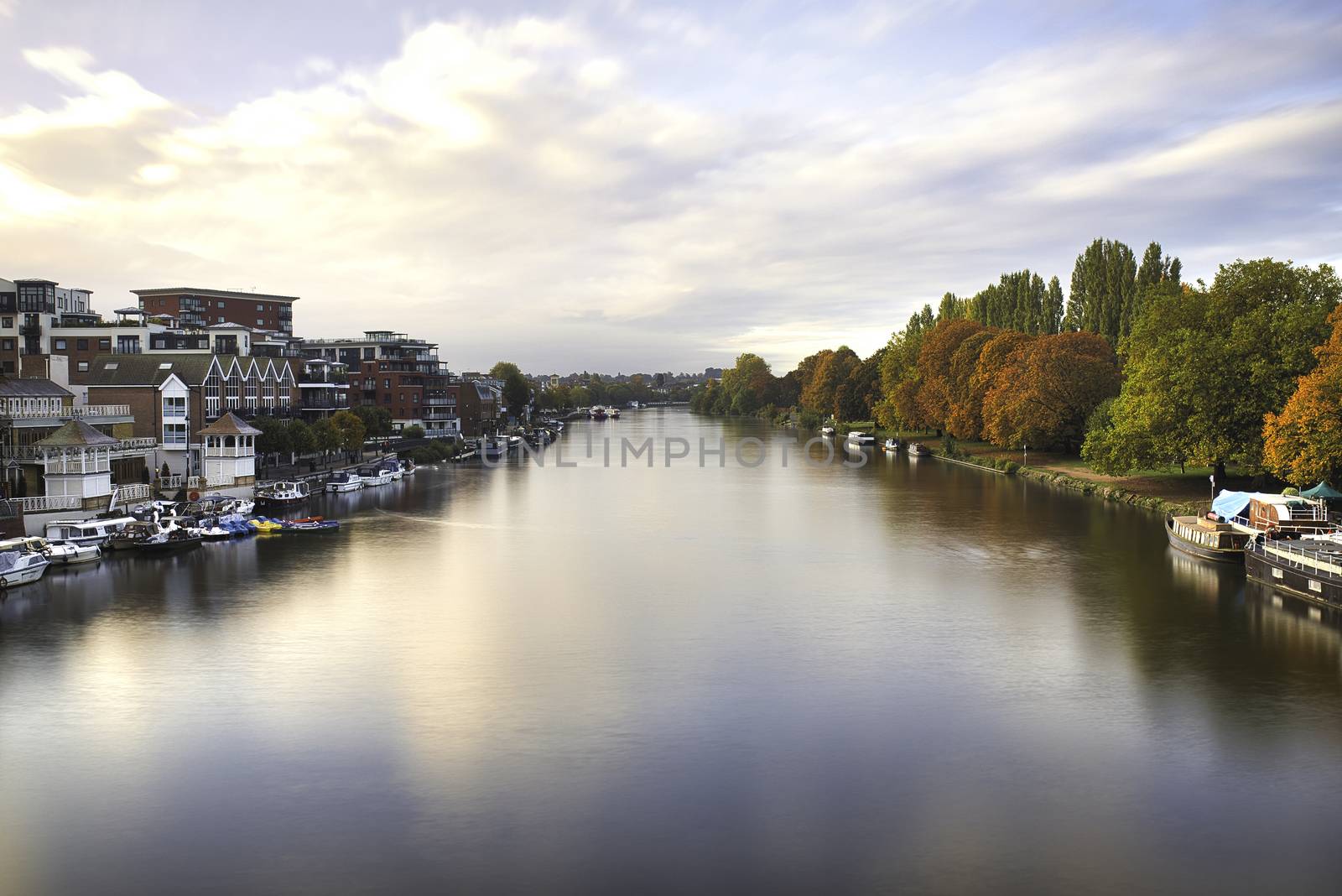 Aerial Landscape Photo Under a Cloudy sky and Over the River Thames, which Divides a Town and a Forest