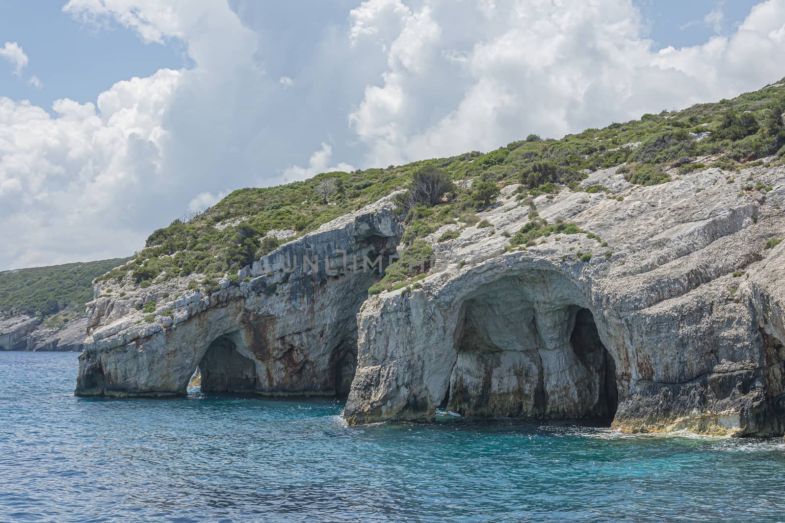 Seascape. Caves in the rocks of the coastline on the island of Zakynthos (Greece). Stock photo