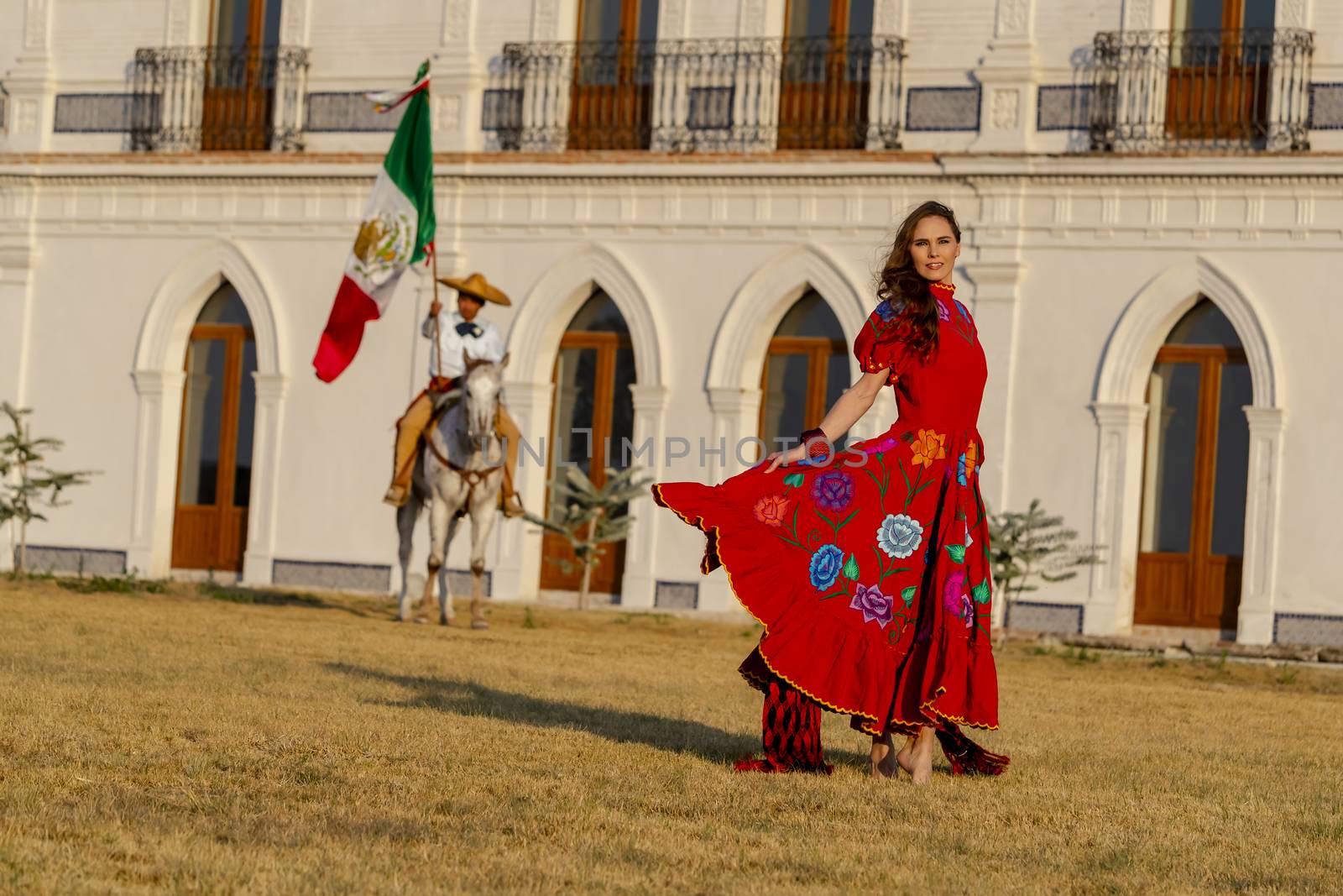 A gorgeous Hispanic Brunette model poses outdoors in home environment