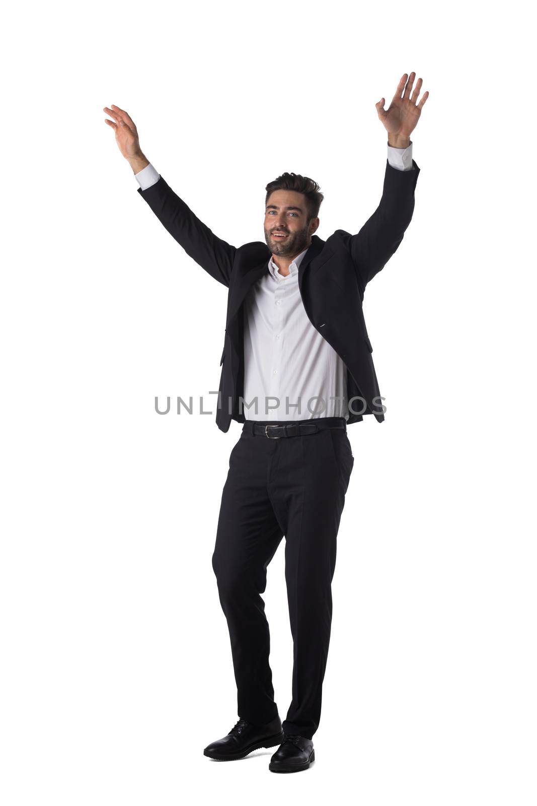 Full length portrait of young handsome business man in black suit with raised arms up studio isolated on white background