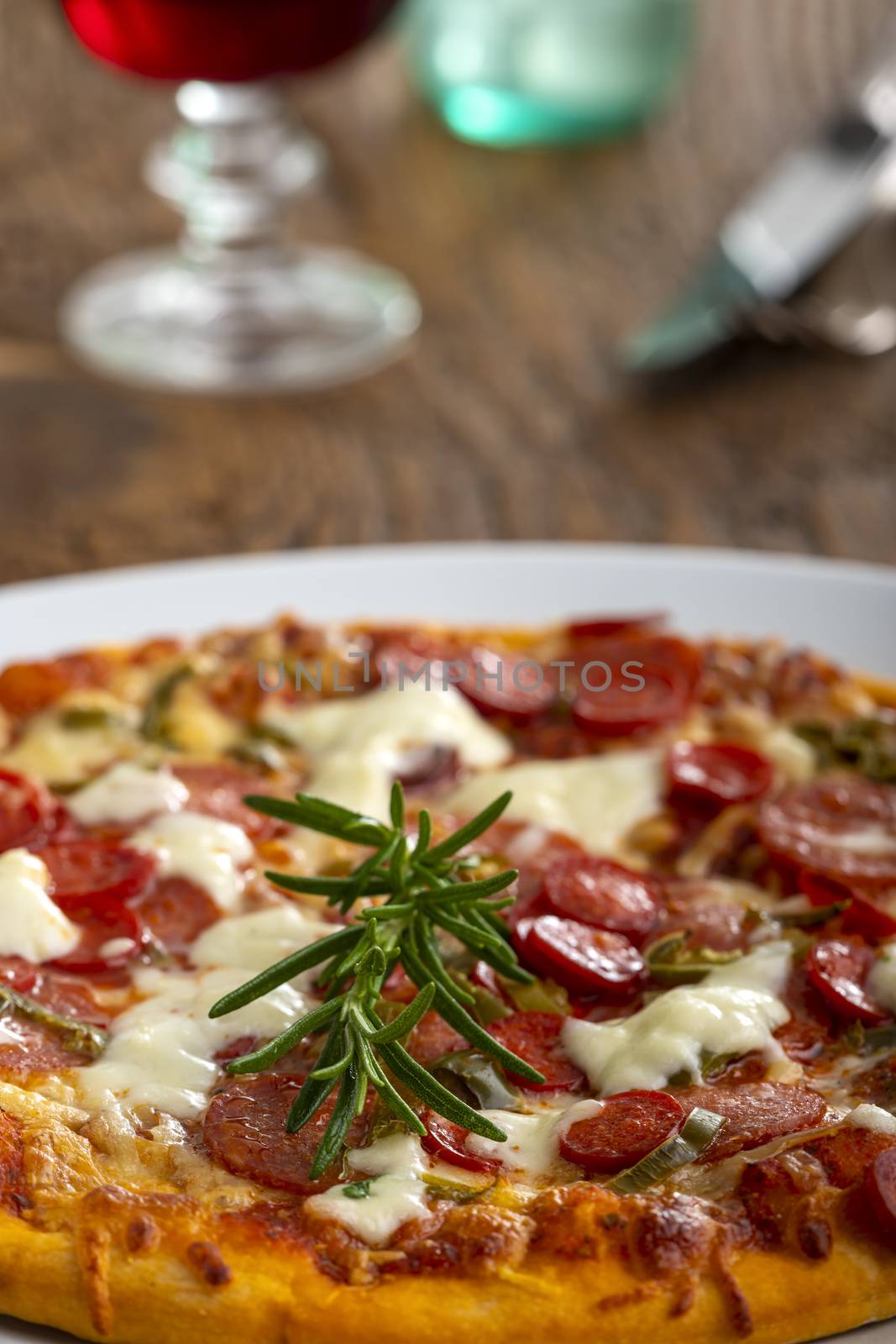 rosemary leaf on a pizza