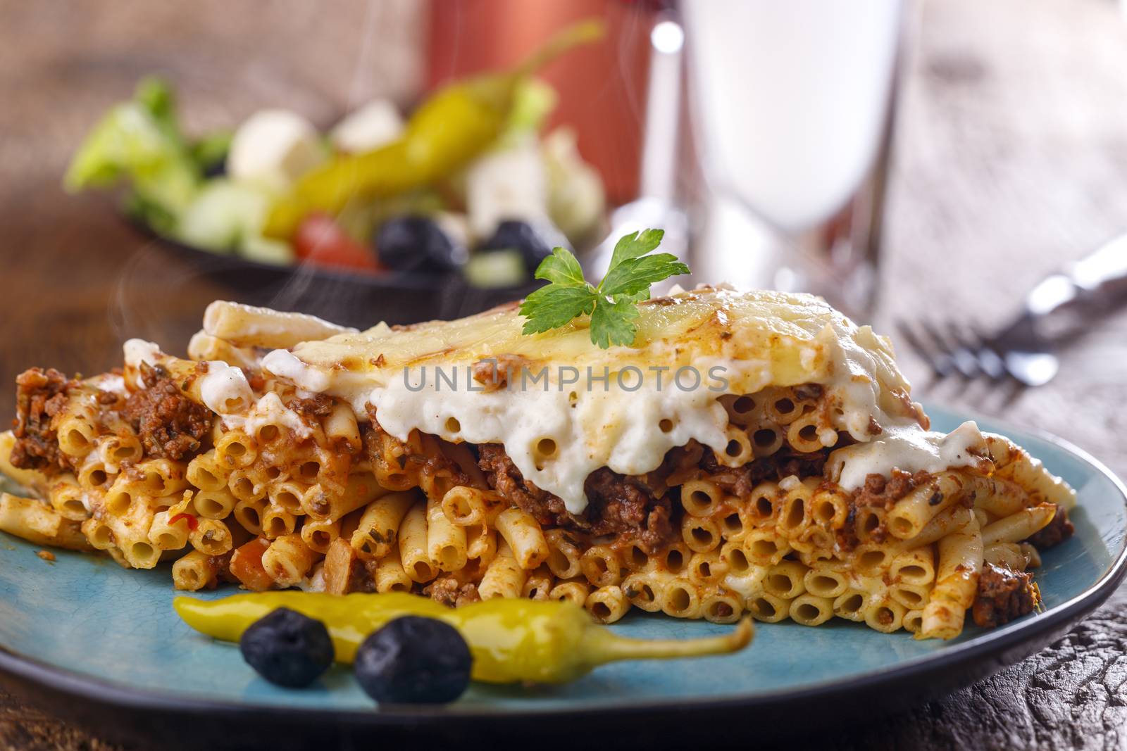 greek Pastitsio dish on a blue plate