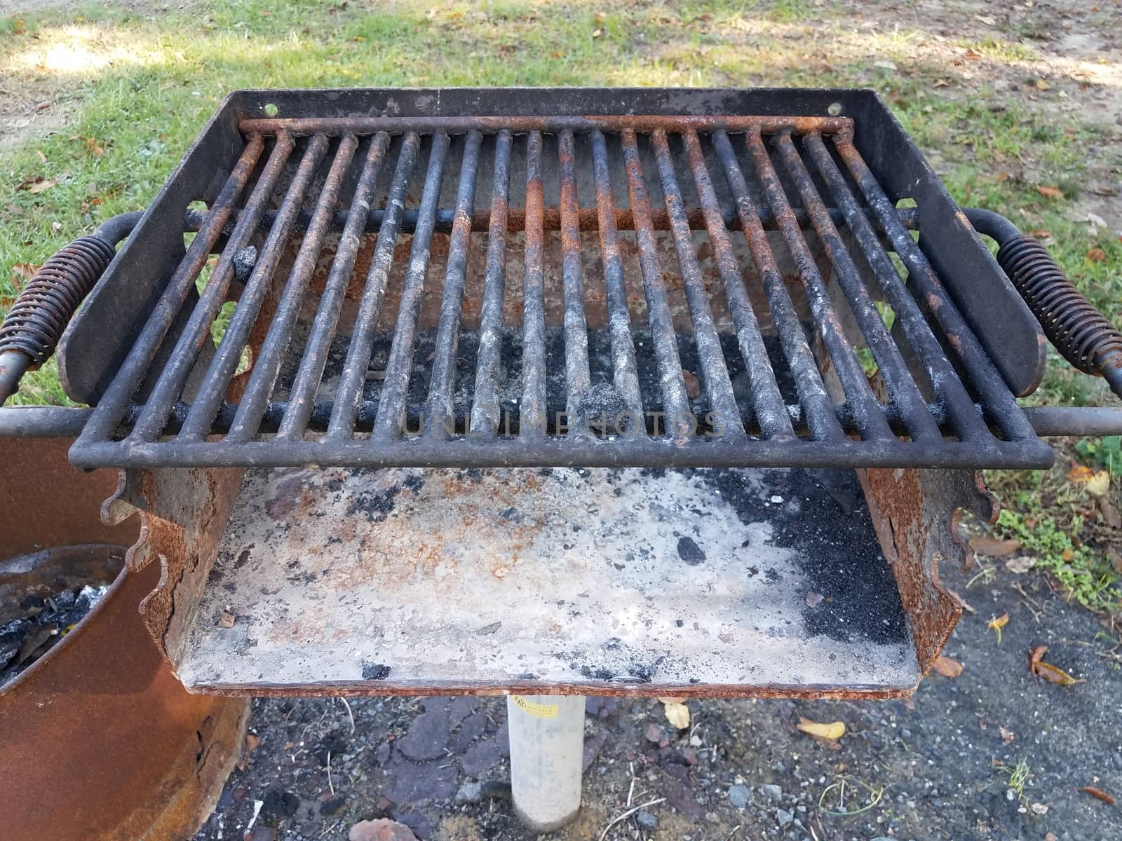 dirty rusty barbecue grill metal with coal ash