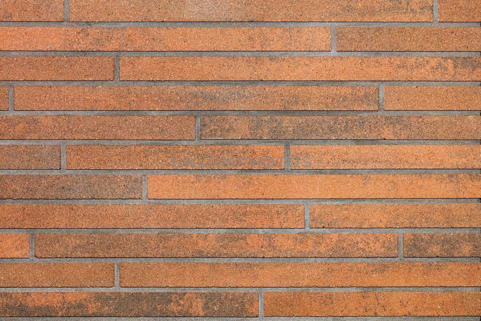 Decorative brown wall surface with smooth horizontal stripes and imitation of brickwork.