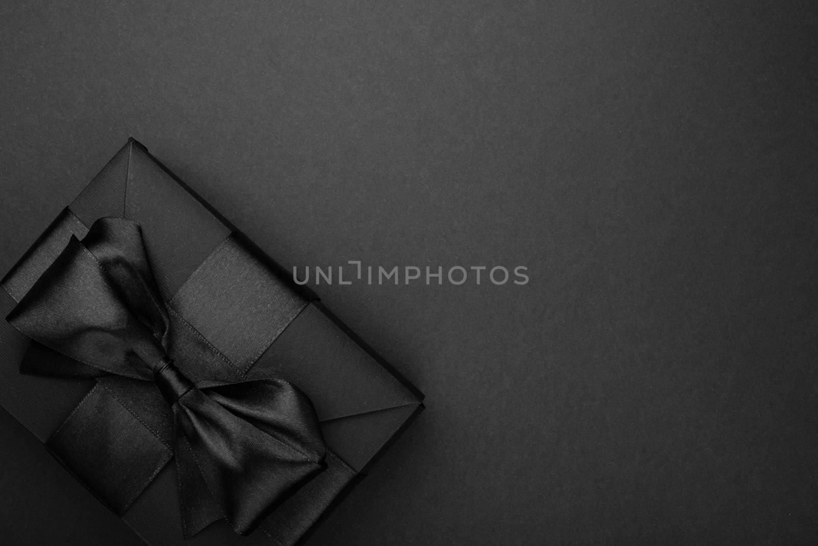 Black friday sale background with box gift present with satin ribbon bow copy space for text